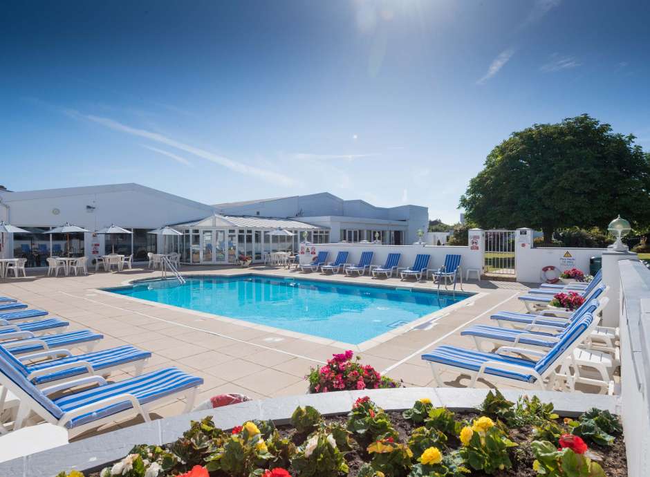 The outdoor pool and sun loungers at the Barnstaple Hotel