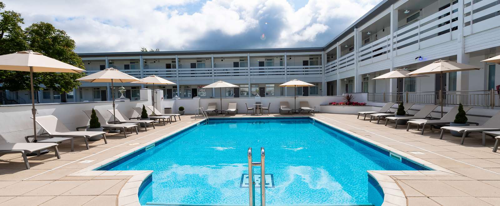 The outdoor pool and sun loungers at the Barnstaple Hotel