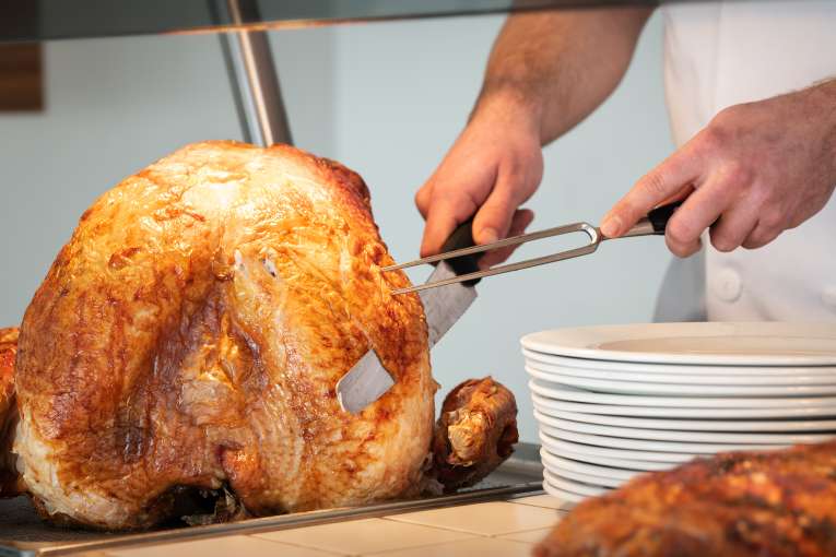 chef carving a turkey