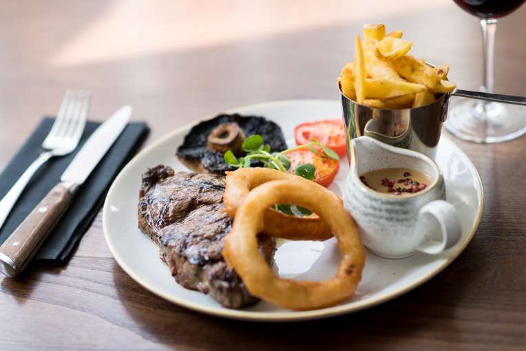 steak, chips and onion rings
