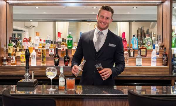 Royal and Fortescue Hotel Bar Manager Serving Drinks