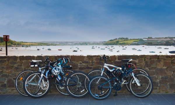 Bikes Leaning on Wall with a View Over the Estuary at Instow North Devon