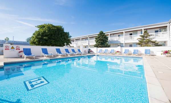The outdoor swimming pool and sun loungers at the Barnstaple Hotel