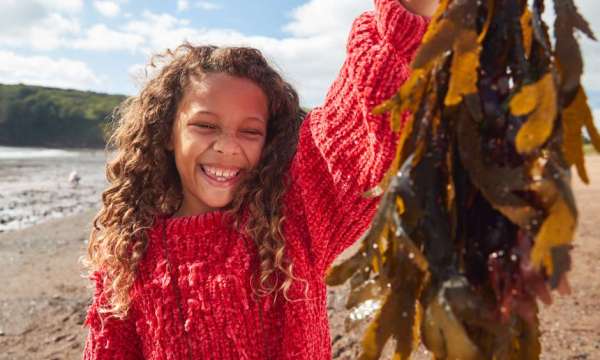 Girl Holding Seaweed 