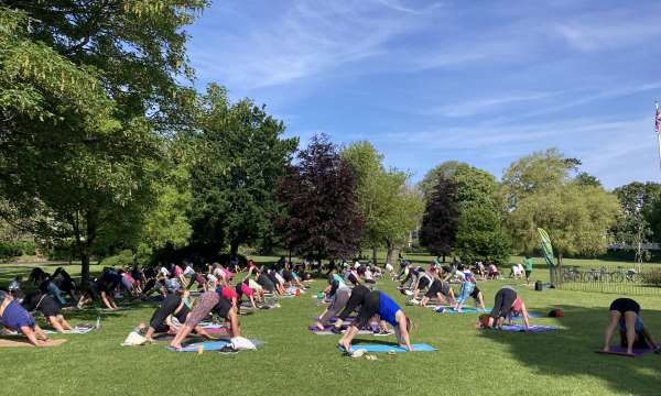 Group of people doing yoga in Rock Park 