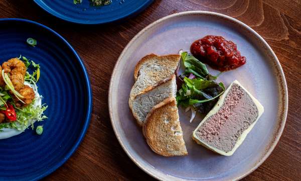 Parfait and two other starters on wooden table 