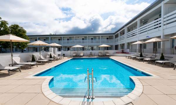 The outdoor pool and sun loungers at the Barnstaple Hotel