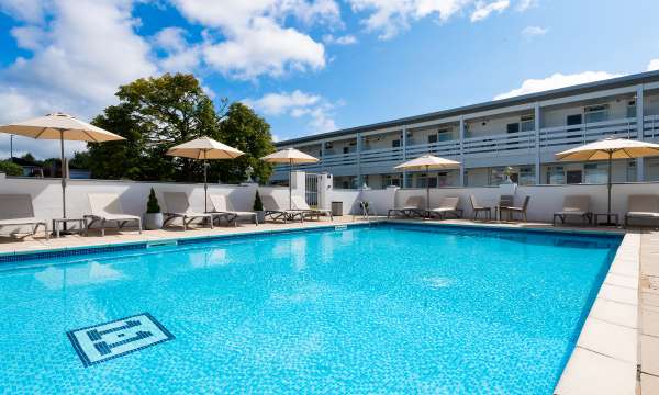 The outdoor swimming pool and sun loungers at the Barnstaple Hotel