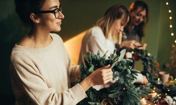 3 ladies making festive wreaths