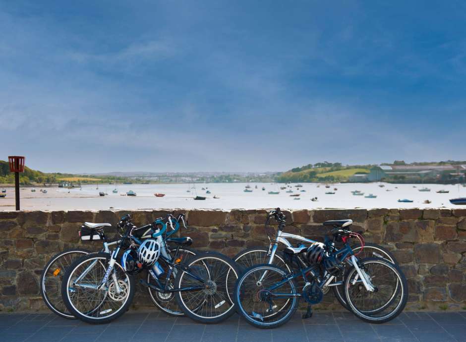 Bikes Leaning on Wall with a View Over the Estuary at Instow North Devon