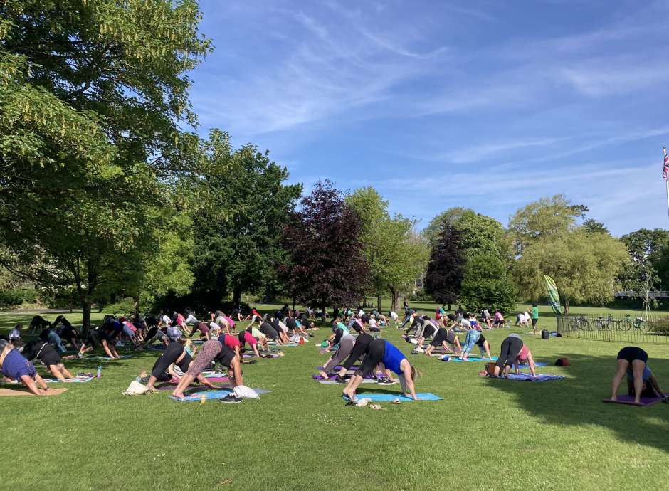 Group of people doing yoga in Rock Park 