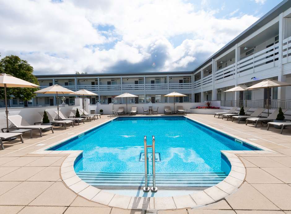 The outdoor pool and sun loungers at the Barnstaple Hotel