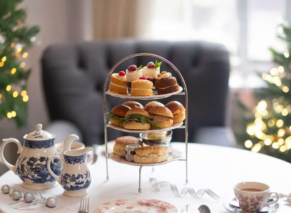 Festive Afternoon Tea with 2 Christmas trees in the background at The Royal & Fortescue Hotel 