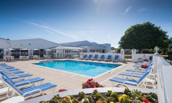 The outdoor pool and sun loungers at the Barnstaple Hotel